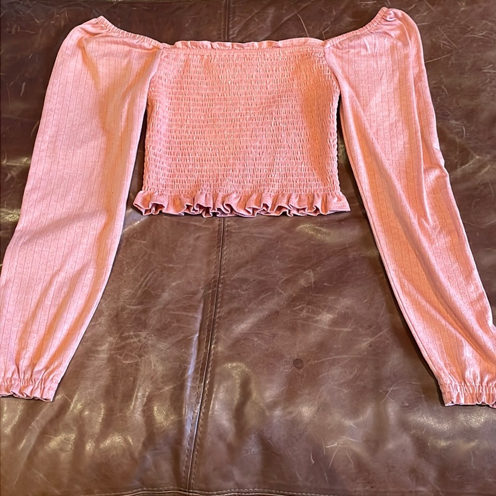 I am selling a peach colored drop shoulder long sleeve blouse from the brand SO!